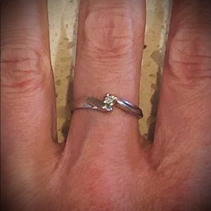10k white gold ring with small diamond.